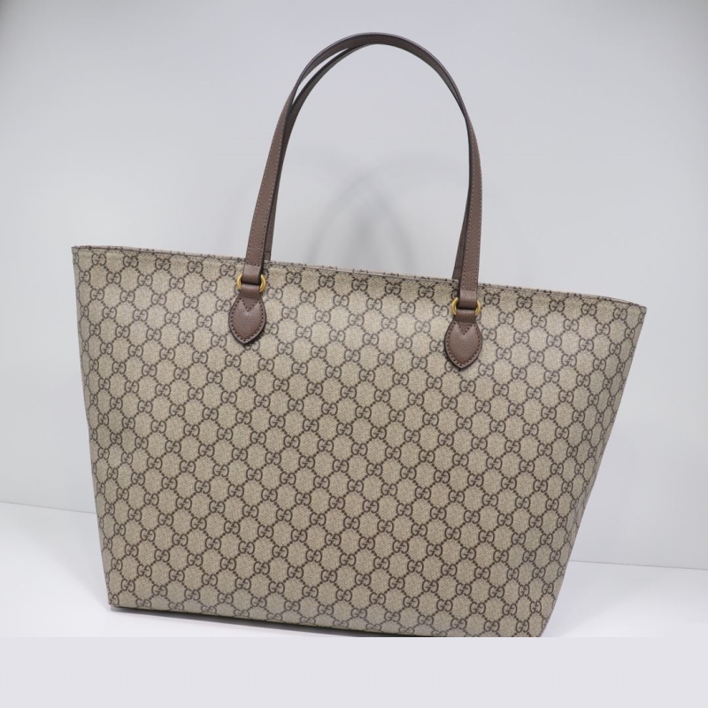 G*u*i shopping bags
